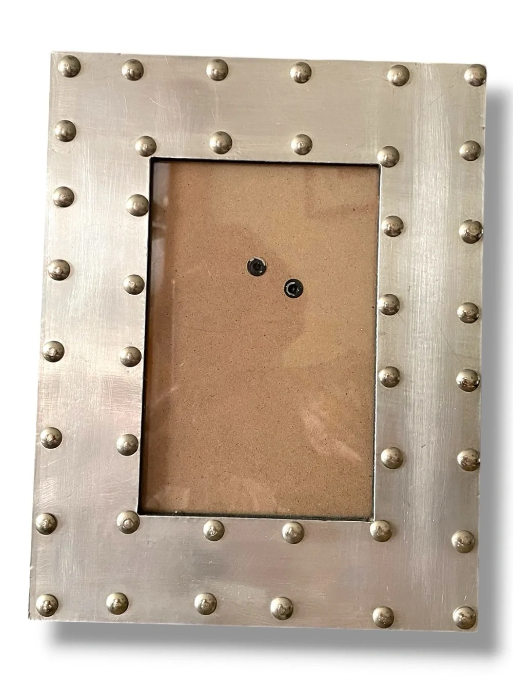 Stonebriar frame, distressed metal, prominent rivets, industrial style, pewter?